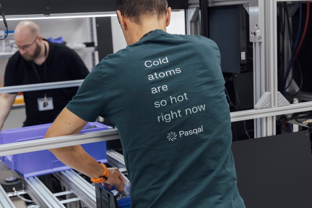 Mechanical engineers building the structure of the  Pasqal Quantum Processing Unit